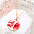 Gold Tone Round Resin Pressed Daisy Pendant Necklaces in Six Colors view 7