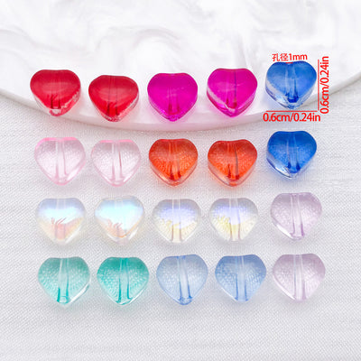 Transparent 6mm glass heart beads arranged as a full product overview