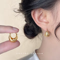 Hammered Sand Texture Bean Huggie Hoop Earrings Gold Silver view 1