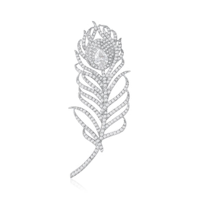 Silver pavé crystal feather brooch on white background