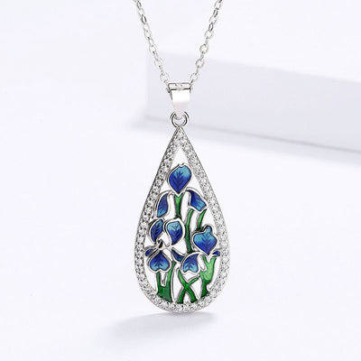 Silver teardrop blue green enamel flower pendant front view