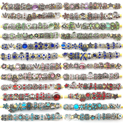 Antique silver spacer bead beads arranged on a light background