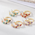 Gold Tone Crystal Enamel Round Evil Eye Hoop Earrings in Five Colors view 1