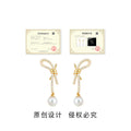 Gold Tone Clear Stone Bow Long Tail And White Pearl Stud Earrings view 3