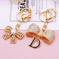 Mixed Letter D Bow and Pearl Mini Bow Keychains in Two Designs view 2