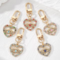 Gold Tone Rhinestone Heart Lash Eye Clip Keychains in Five Colors view 1
