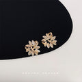 Gold Tone Ivory Enamel Interlocking Leaf Cluster Stud Earrings view 4