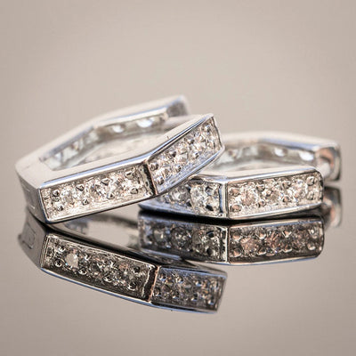 Alternate product view of silver tone hexagonal huggie earrings with clear stone rows