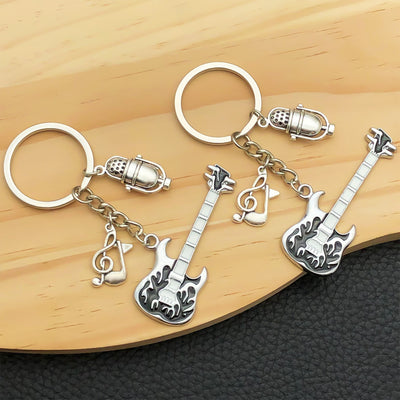 Overview showing the available color and design variations of the antique silver guitar microphone and music keychain