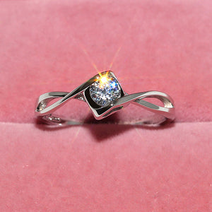 Silver-Tone Twisted Band Ring with Round Cubic Zirconia, Brass