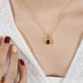 Gold Oval Black Stone Pendant Necklace Geometric Frame view 4