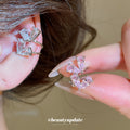 Double Heart Crystal Single Ear Clips with Polished Metal Tone Details view 1