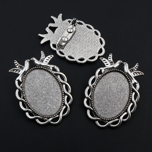 Ornate Oval Cabochon Brooch Bezel Settings in Six Styles, close view of the finish and front surface