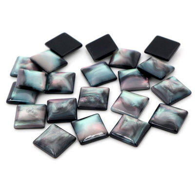 Square cabochons arranged assortment on a white background