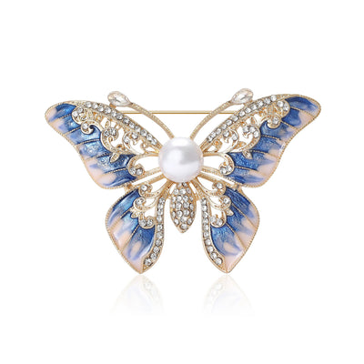 Front view of enamel butterfly brooch with pearl center and crystals