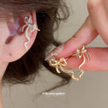 Minimal Ribbon Bow Ear Clips in Gold and Silver Tones view 1