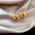 Triple Curve Metal Stud Earrings in Gold and Silver view 6