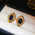 Gold Tone Oval Textured Stud Earrings with Black Centers view 2