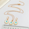 Gold Tone Round Pearl Blue Evil Eye Pendant Necklace and Earrings view 2