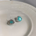 Silver Tone Heart Stud Earrings Teal Stone Crystal Halo view 1