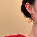 Red Enamel Horse Drop Earrings with Gold Tone Floral Studs view 4