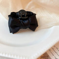 Black Satin Bow Hair Claw With Layered Loops And Knotted Center view 6