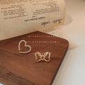 Gold Tone Asymmetric Hollow Bow And Pave Heart Stud Earrings view 2