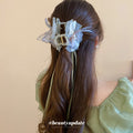 Gray Green Translucent Bow Hair Claw With Pearl Like Center And Ribbon Tails view 3