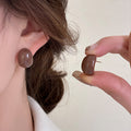 Glossy Oval Stud Earrings In Brown And Red In Two Color Options view 4