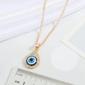 Gold Tone Crystal Teardrop Evil Eye Pendant Necklace with Fine Chain view 5