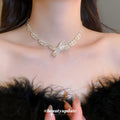 Silver Tone Bow Necklace with Textured Ribbon Links view 1