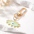 Gold Tone Exploding Evil Eye Clip Keychains in Five Colors view 2