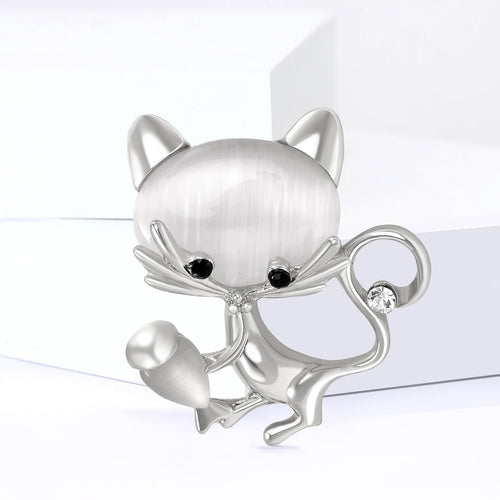 Silver cat-eye cat brooch close-up front view on white display