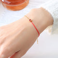 Gold Red Cord Birthstone Bracelet with Round Zircon Charm view 1