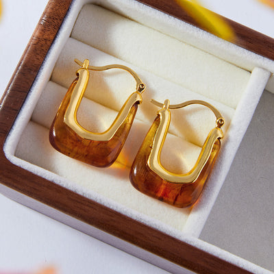 Gold amber resin U-hoops in wooden jewelry box