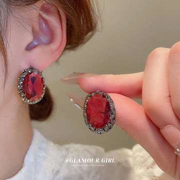 Dark Silver Tone Oval Stud Earrings With Faceted Red Centers