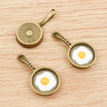 Fried Egg Frying Pan Enamel Charms in Two Antique Finishes view 2