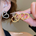Silver Tone Twisted Open Heart Stud Earrings with Textured Edges view 1