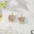 Gold Tone Pressed Flower Butterfly Drop Earrings in Twelve Designs view 6