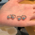 Silver Tone Star Shaped Huggie Earrings with Clear Crystals view 4