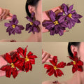 Oversized Red Acrylic Flower Stud Earrings with Yellow Centers view 2