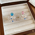 Silver Open Floral Bouquet Ring Oval Center Stone Two Colors view 4