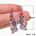 Crystal Ribbon Bow Dangle Earrings in Gold and Silver Tones view 5