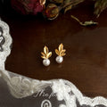 Matte Gold Maple Leaf Pearl Stud Earrings White Accent view 4