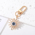Gold and Silver Tone Geometric Hamsa and Eye Clip Keychains view 11