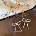 Slim Bow Stud Earrings In Brown Blue And White Patterns view 3