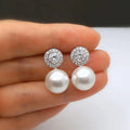 Pearl-Like Drop Stud Earrings With Round Clear Stone Halos view 1