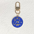 Gold Tone Round Enamel Eye and Celestial Clip Keychains view 3