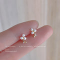Gold Tone Curved Branch And Three White Pearl Mini Stud Earrings view 1