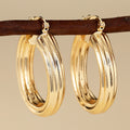 Triple Band Hoop Earrings in Gold-Tone Metal Jewelry view 1